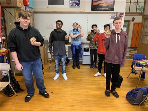 Students holding cookies